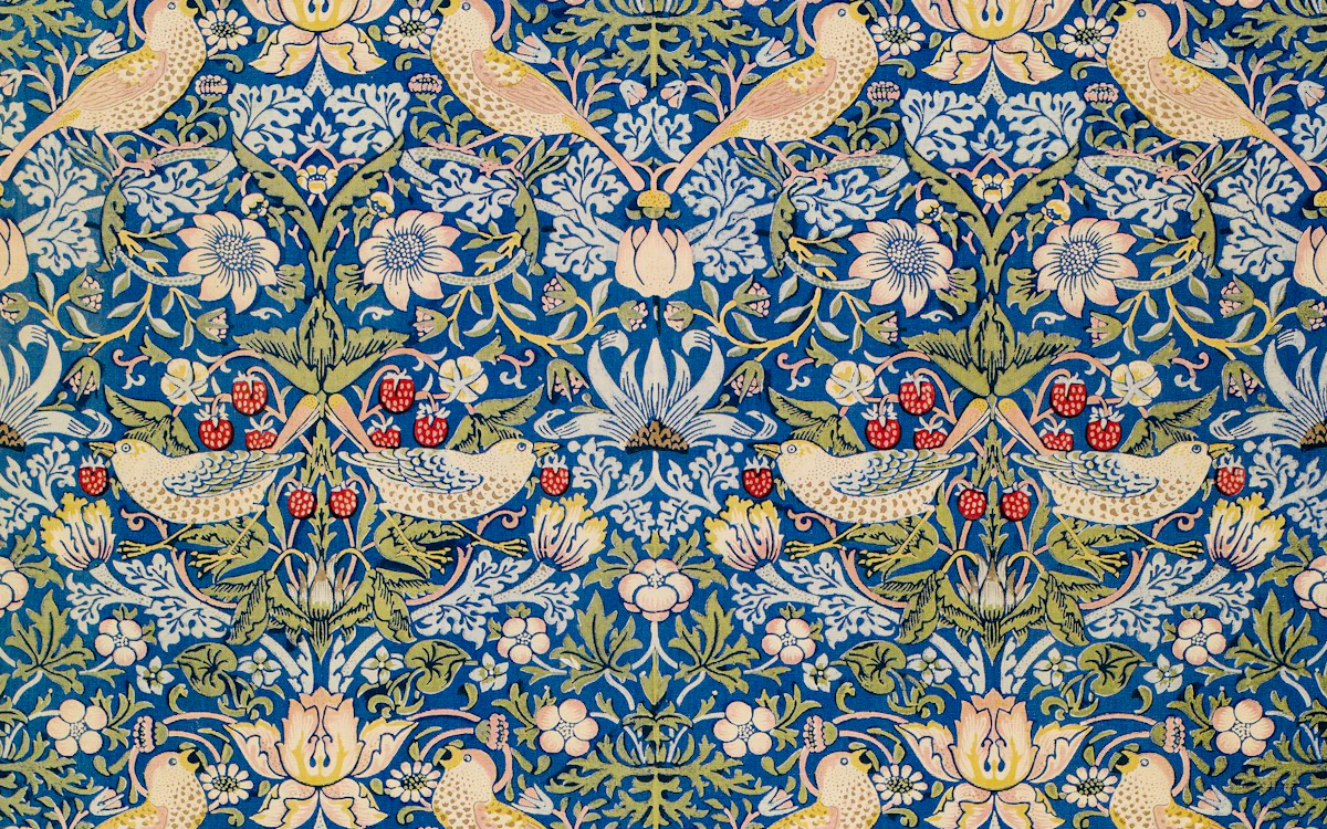 Blau-cremefarbener Jacquardstoff mit floralem Wiederholmuster.